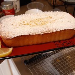 A picture of Lemon loaf pound cake with icing sugar.