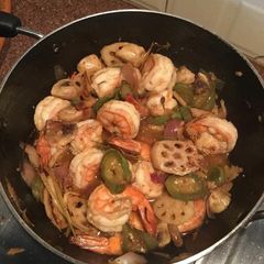 A picture of Flash fried prawns and vegetables.