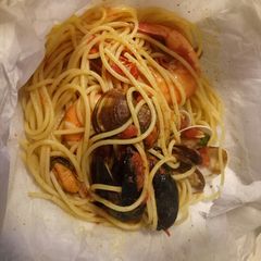 A picture of Spaghetti frutti di mare al cartoccio.