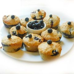 A picture of COCONUT MUFFINS with blue berries and chocolate chips.