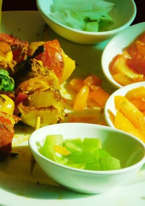 A picture of Paneer Tikka with colorful veggies.
