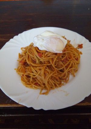 A picture of Spaghetti with poached egg.