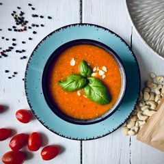 A picture of Tomato soup with cashew.