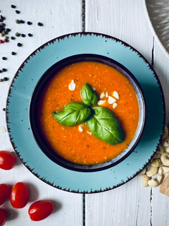 A picture of Tomato soup with cashew.