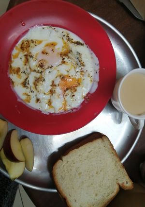 A picture of Turkish style: poached eggs with yogurt.