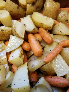 A picture of Oven-roasted Potatoes and Carrots with Thyme.