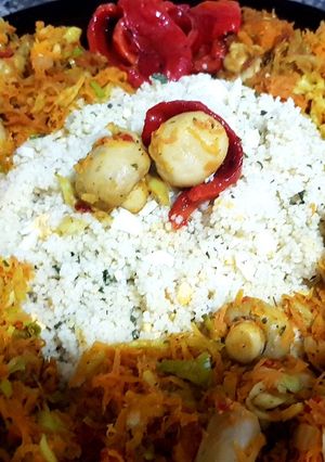 Una foto de Cous cous con champiñones y vegetales