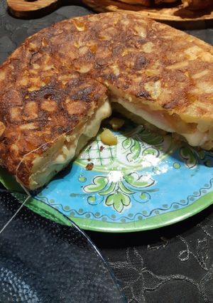 Una foto de Tortilla de papá rellena