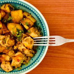 A picture of Curried potatoes & turmeric chicken.