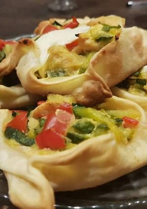 Una foto de Canastitas de zapallito, pollo y queso