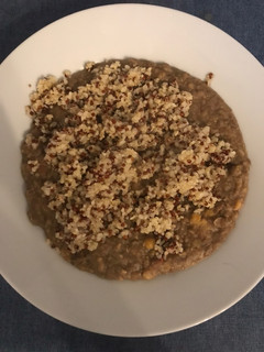 A picture of Legume and grain soup with tahini sauce.