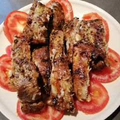A picture of Pork Ribs on Tomato.