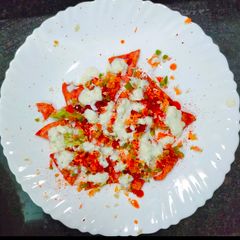 A picture of Nachos with Salsa and Cheese Sauce.