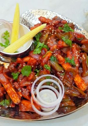 A picture of Honey chilli Babycorns.