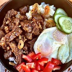 A picture of Filipino Wagyu Beef Tapa with Garlic Fried Rice.