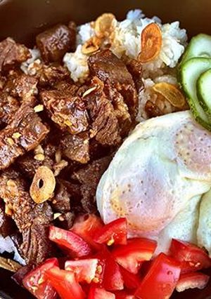 A picture of Filipino Wagyu Beef Tapa with Garlic Fried Rice.