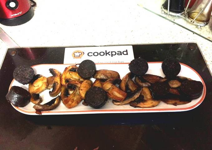 My Butter Fried Mushrooms with Grilled Black pudding sliced.π