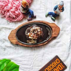 A picture of Homemade Sizzler Biscuit Brownie with ice cream.