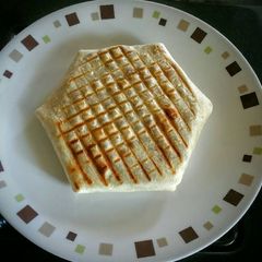 A picture of Homemade Steak Crunchwrap Grilled in a Panini Press.