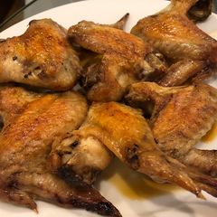 A picture of Baked chicken wing with Shoyu and lemon.