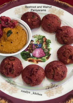 A picture of Beetroot and Walnut Paniyarams.