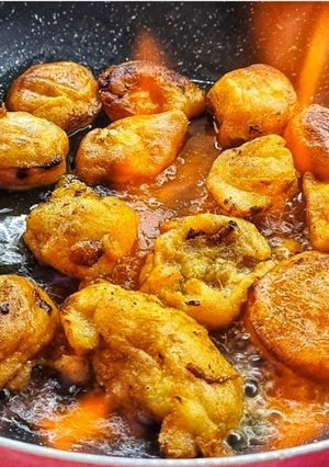 Una foto de Buñuelos de plátano flambeados con ron 🇸🇨