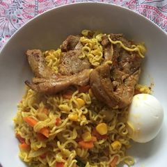 A picture of Spicy noodles with lamb chops.