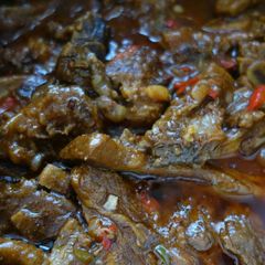 A picture of Beef stew with peppers.