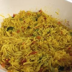 A picture of Rice with veggies.