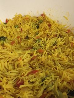 A picture of Rice with veggies.