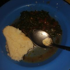 A picture of Ugali and kienyeji vegetables.