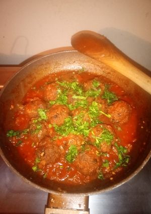 A picture of Meatballs in sauce.