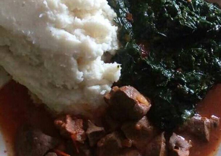 Liver stew and ugali served with veges