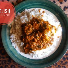 A picture of White rice and banga stew.