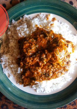 A picture of White rice and banga stew.