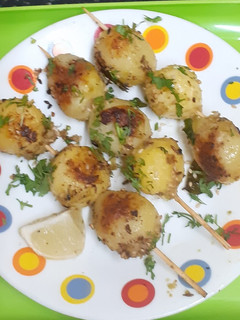 A picture of Farali Grilled Potatoes with Sesame seeds.