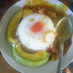 A picture of Creamy Egg Curry and milk Rice.