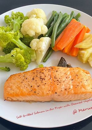 A picture of Salt Grilled Salmon in Air Fryer with Steamed Vegetables.