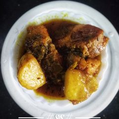 A picture of Bengali style Potato with Rui fish curry.