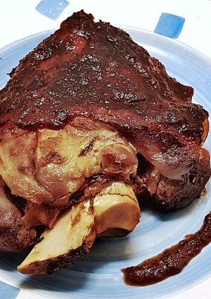 A picture of Slow-Cooked Pork Shank in Crock Pot at Low Temperature.