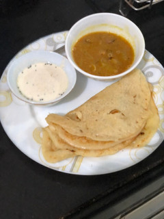 A picture of Pumpkin Uttapam, sambhar and chutney.