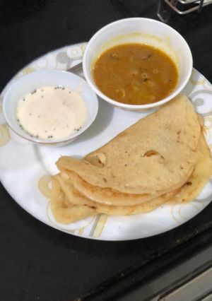 A picture of Pumpkin Uttapam, sambhar and chutney.