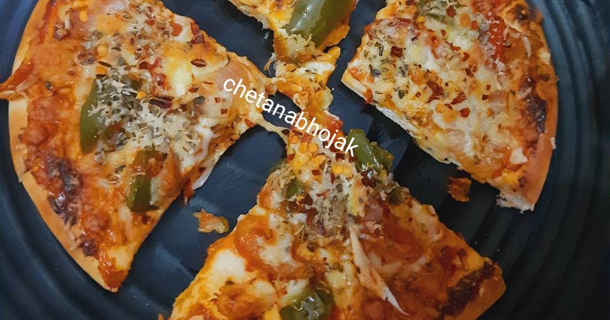चीजी व्हेज पिझ्झा (Cheesy Veg Pizza Recipe In Marathi) रेसिपी Chetana