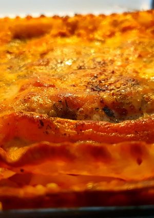 A picture of Cheese lasagna with vegan meatballs.