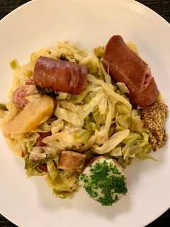 A picture of Cabbage with Sausages (Choucroute Garnie or Sauerkraut with Sausages).