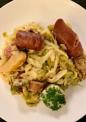 A picture of Cabbage with Sausages (Choucroute Garnie or Sauerkraut with Sausages).