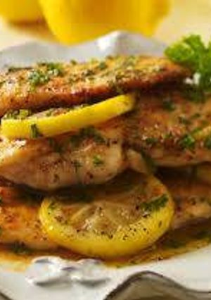 A picture of Lemon chicken and artichoke piccata.