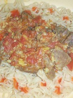 A picture of Indomie noodles and beef stew.
