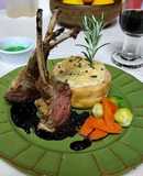 Rack of lamb with red wine sauce, garlic mashed potatoes, Brussels sprouts and carrots