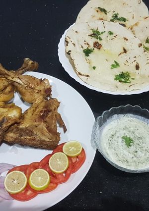 A picture of Chicken tikka with homemade tawa naan.